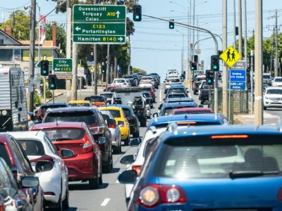 Heavy traffic congestion in Geelong Australia, with multiple lanes of cars waiting at a traffic light on Christmas Day of 2024 to leave town for holiday